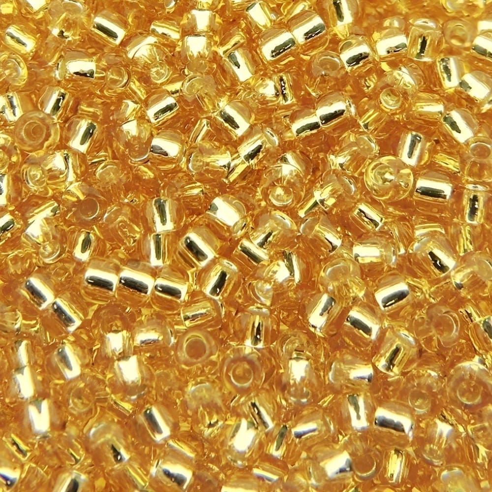 Toho Seed Beads Round Size 11/0 28GM Silver Lined Light Topaz