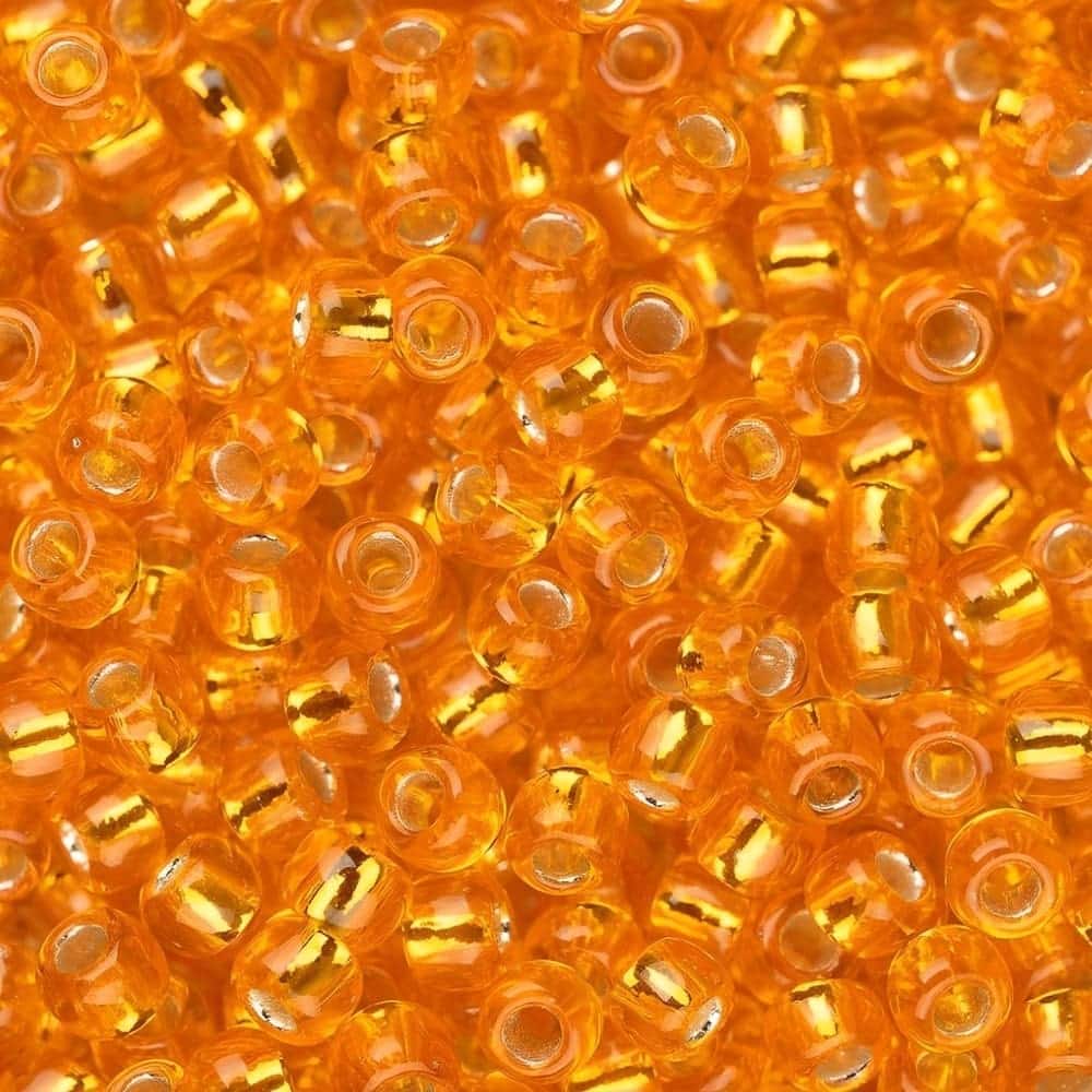 Toho Seed Beads Round Size 11/0 28GM Silver Lined Light Hyacinth Orange